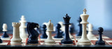 Black and Cream Weighted Plastic Chessmen & Bag